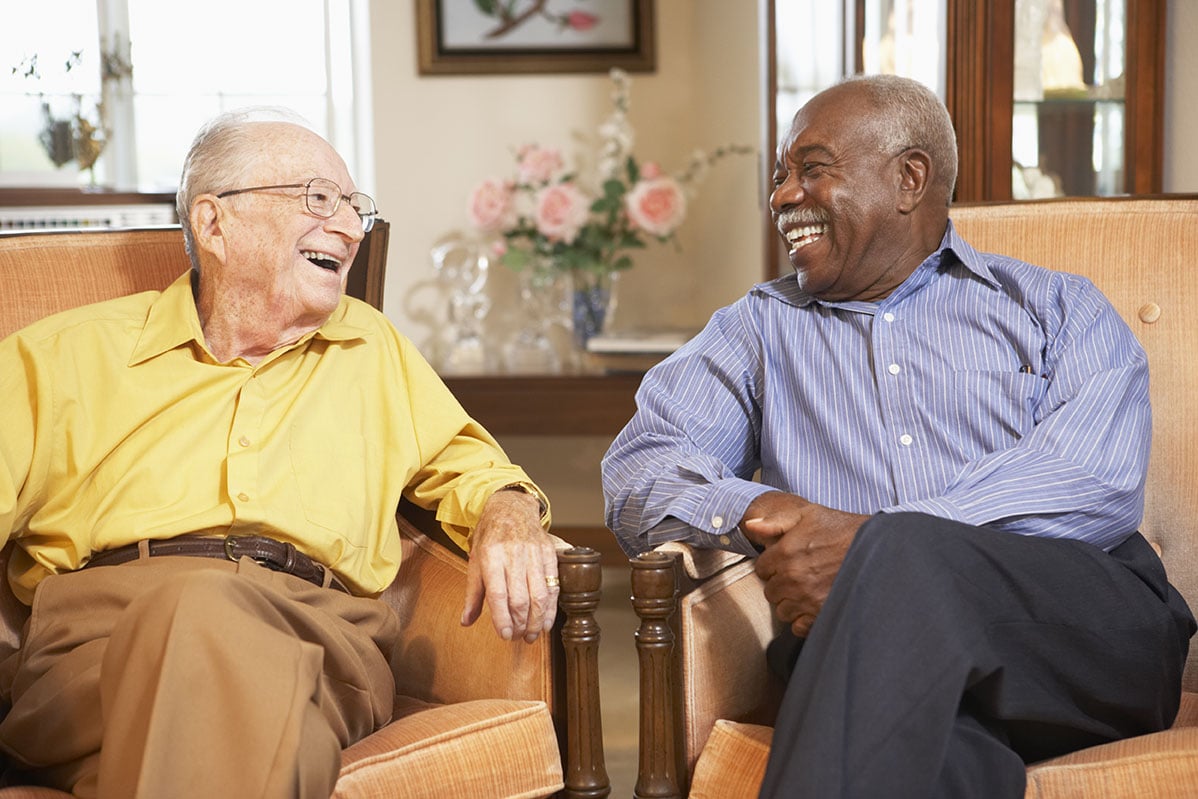 Residents laughing together at The Lodge at Wake Forest